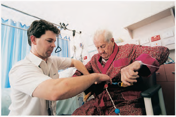 This photo shows a health service professional working with a patient