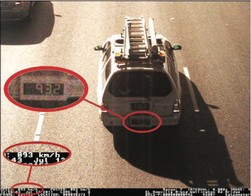 Calibrated test vehicles have a large speed display at the back of the vehicle. As the vehicle travels past the speed camera, it is detected and photographed by the speed camera. This allows the speed camera measurement and the calibrated vehicle measurement to be compared. This is shown in this photograph.