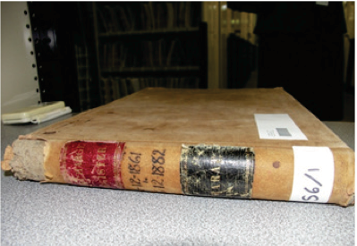 Photo of a old book in disrepair.