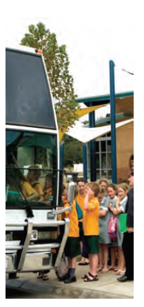 Photo of a school bus and children queuing to get on board. Photo courtesy of DEECD.