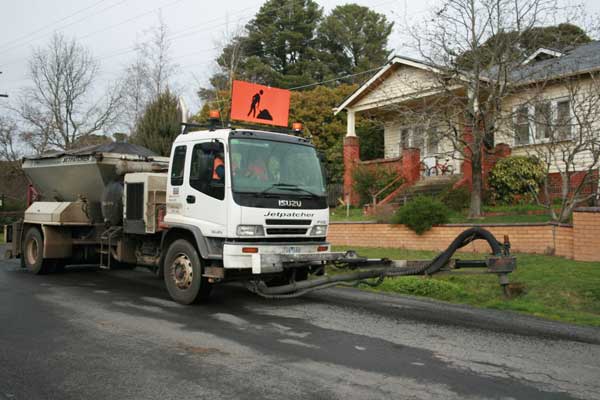 Photograph shows road sealing, courtesy of Hepburn Shire Council.