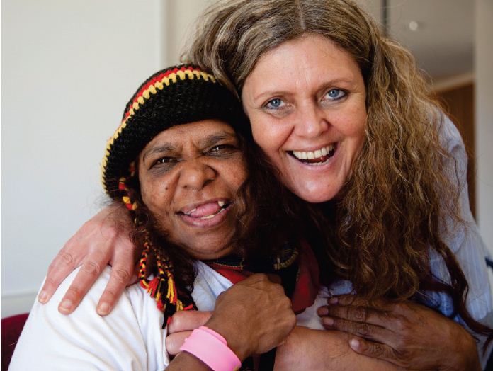 Image of a nurse embracing a patient at the Gippsland Community Health Service. Photograph courtesy of Tobias Titz.