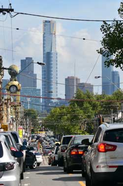 Image displays a line of cars in traffic. Photograph courtesy of ChameleonsEye/Shutterstock.com.