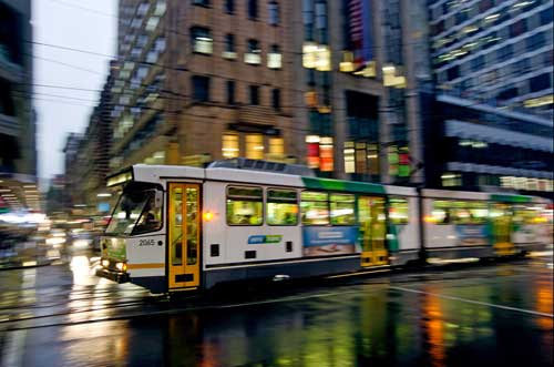 Image of a tram passing through an intersection in Melbourne.