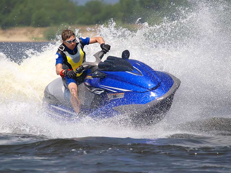 Image of a man riding a jetski. Photograph courtesy of Crok Photography/Shutterstock.