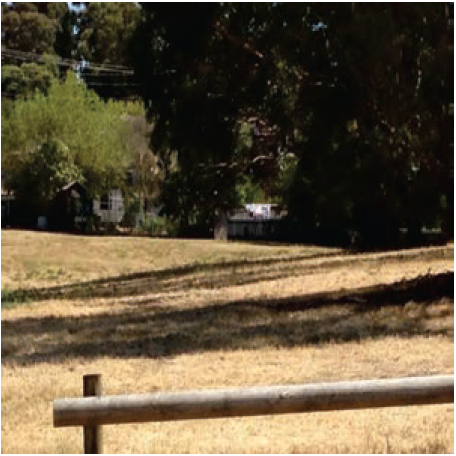 Image shows a closed landfill site that has been rehabilitated as a recreation reserve and is surrounded by residential development. Gas and leachate monitoring bores are in place but not visible in this photograph.