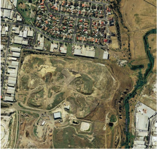 Image shows a closed landfill, with development adjacent to the landfill boundary on two sides. Imagery copyright 2014 CNES/Astrium, DigitalGlobe, Sinclair Knight Merz & Fugrot. Map data copyright 2014 Google.