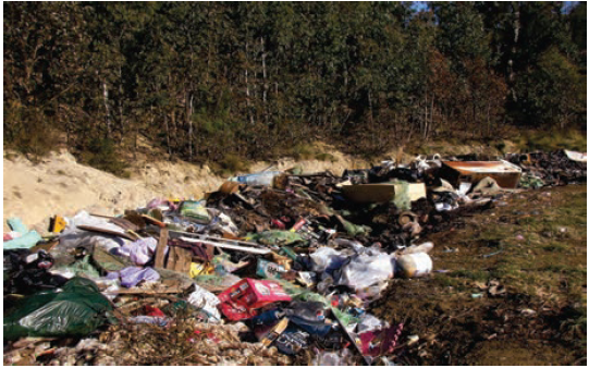 Image shows a small unmanned, unlicensed landfill consisting of a single trench. Photograph courtesy of East Gippsland Shire Council.