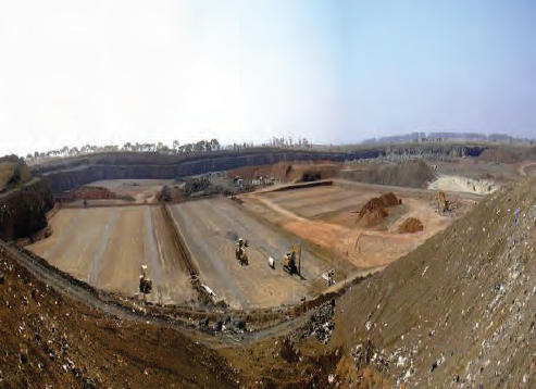 Photo shows a large cell being built adjacent to cell already filled. Photograph courtesy of the Environment Protection Authority.