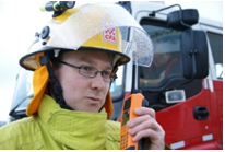 Image shows a CFA member holding a RMR radio. Photograph courtesy of CFA Strategic Communications.