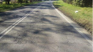 Image shows cracking on road