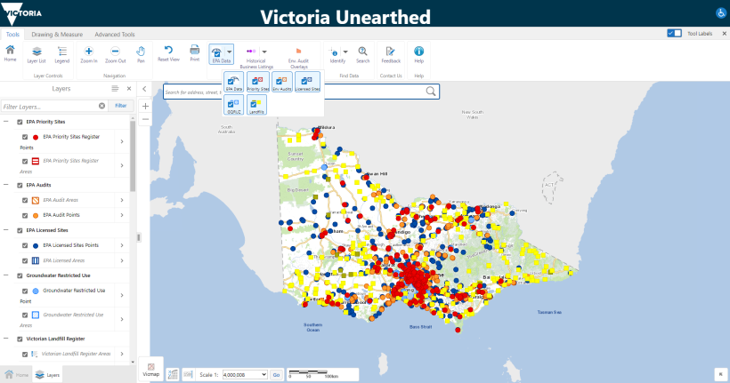 Figure 1 is a screenshot of Victoria Unearthed. It is a data dashboard that shows a map of Victoria. Within Victoria there are clusters of coloured dots, which show EPA Priority Sites Register points and areas, EPA Audit Points, EPA Licensed Sites points, Groundwater Restricted Use points, and Victorian Landfill Register areas. There is a toolbar across the top of the map where users can zoom in and out and access other controls. There is a layers panel on the left where users can turn layers on and off.