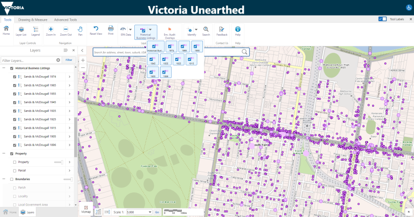 Figure 3 is a screenshot of Victoria Unearthed. It is a data dashboard that shows a zoomed in map of a residential area in Melbourne with the Historical Business Listings layer turned on. There are clusters of light and dark purple dots across the map. These dots indicate where historical business listings have been. There is a toolbar across the top of the map where users can zoom in and out and access other controls. There is a layers panel on the left where users can turn layers on and off.