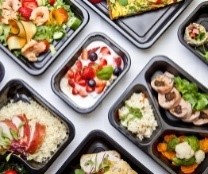 Food portions in trays for serving.