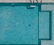 Aerial photo of a backyard pool.