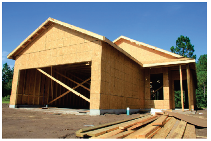 image shows a house mid-construction