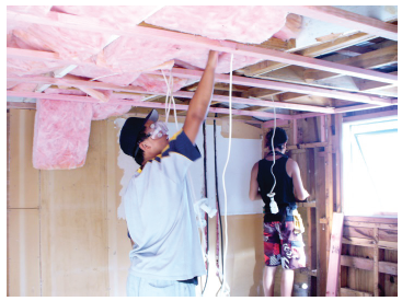 Image of two building working on the inside of a house