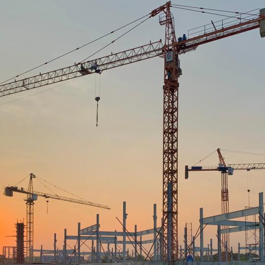 Cranes on building site.