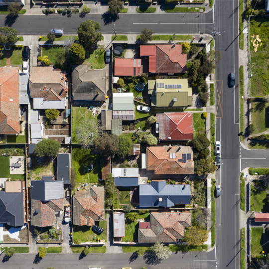 Aerial photo of a block of houses in a Melbourne suburb on a sunny day.