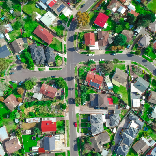 Aerial photo of suburban houses and streets.