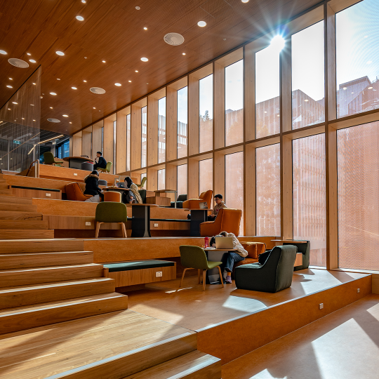 Students studying in a communal area of a Victorian university.