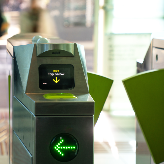 myki card reader device next to entry barrier 