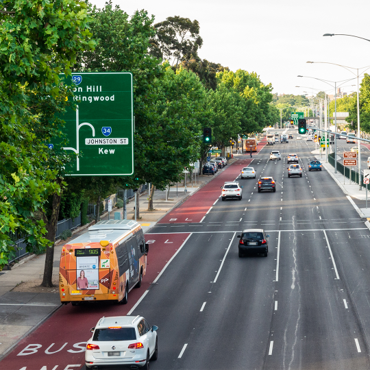 A bus travelling down the bus lane on Hoddle Street.