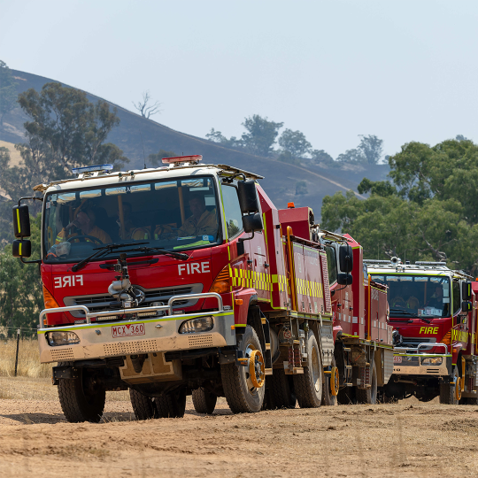 Fire trucks parked in a line in country Victoria