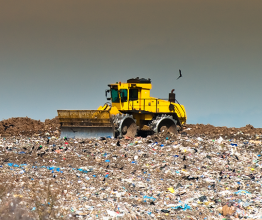 Bulldozer ploughing through a landfill site. Photo courtesy of Christopher Elwell/Shutterstock.com