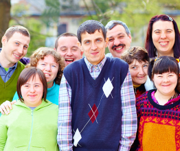 Image of group of happy people with disabilities. Photo courtesy of Olesia Bilkei/Shutterstock.com