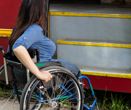 Image of woman of wheelchair having problem with public transport. Photo courtesy of Photographee.eu/Shutterstock.com