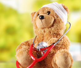 Image of Bandaged Plush Teddy Bear with Stethoscope Device. Photo courtesy of stockcreations/Shutterstock.com
