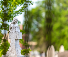 Adam Calaitzis/Shutterstock - Angel statue at a cemetery