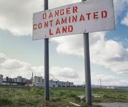 Image shows polluted land, formally a steel mill. Photo courtesy of Silent Corners/Shutterstock.com