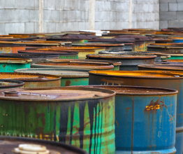 Image shows several barrels of toxic waste at the dump. Photo courtesy of Anna Vaczi/Shutterstock.com