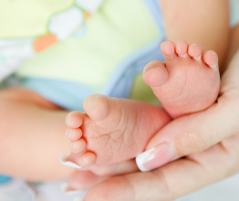 AnikaNes/Shutterstock - newborn baby feet 