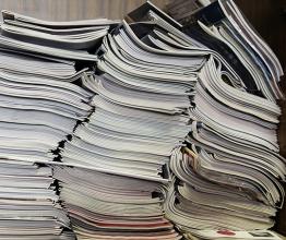 A pile of documents and magazines. Photo courtesy of Oleg Golovnev/Shutterstock.com