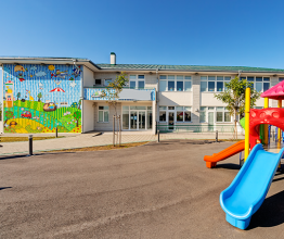 Image of school building courtesy of Vladimir Nenezic/Shutterstock.com