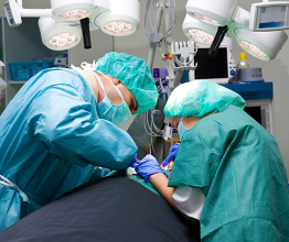 Two surgeons operating in an operating theatre. Photo courtesy of Gergely Zsolnai/Shutterstock.com