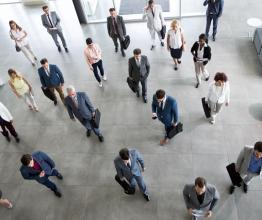 Image shows business people in the suit going on business meeting in the company. Photo courtesy of Lucky Business/Shutterstock.com