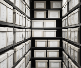 Shelves filled with boxes in an archive room. Photo courtesy of pp1/Shuttestock.com