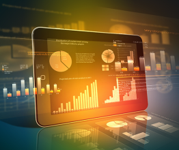 Ipad with diagrams and colours shining on background. Photo courtesy of Sergey Nivens/shutterstock.com 