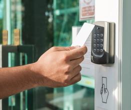 Man using security pass to access building. Photo courtesy of Sasin Paraksa/shutterstock.com