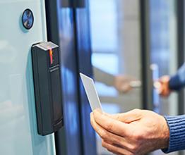Using electronic card key for access. Photo by Dmitry Kalinovsky/Shutterstock.com