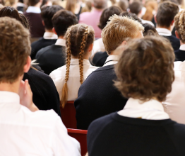 School students sitting in assembly.