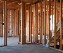 The wooden frame of a house under construction.