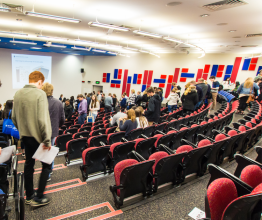 University students leaving a lecture theatre.