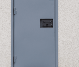 Grey metal door at a prison