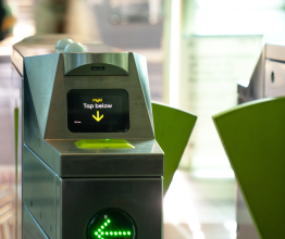 myki card reader device next to entry barrier 