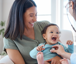 A mother and baby with a stethoscope to the chest